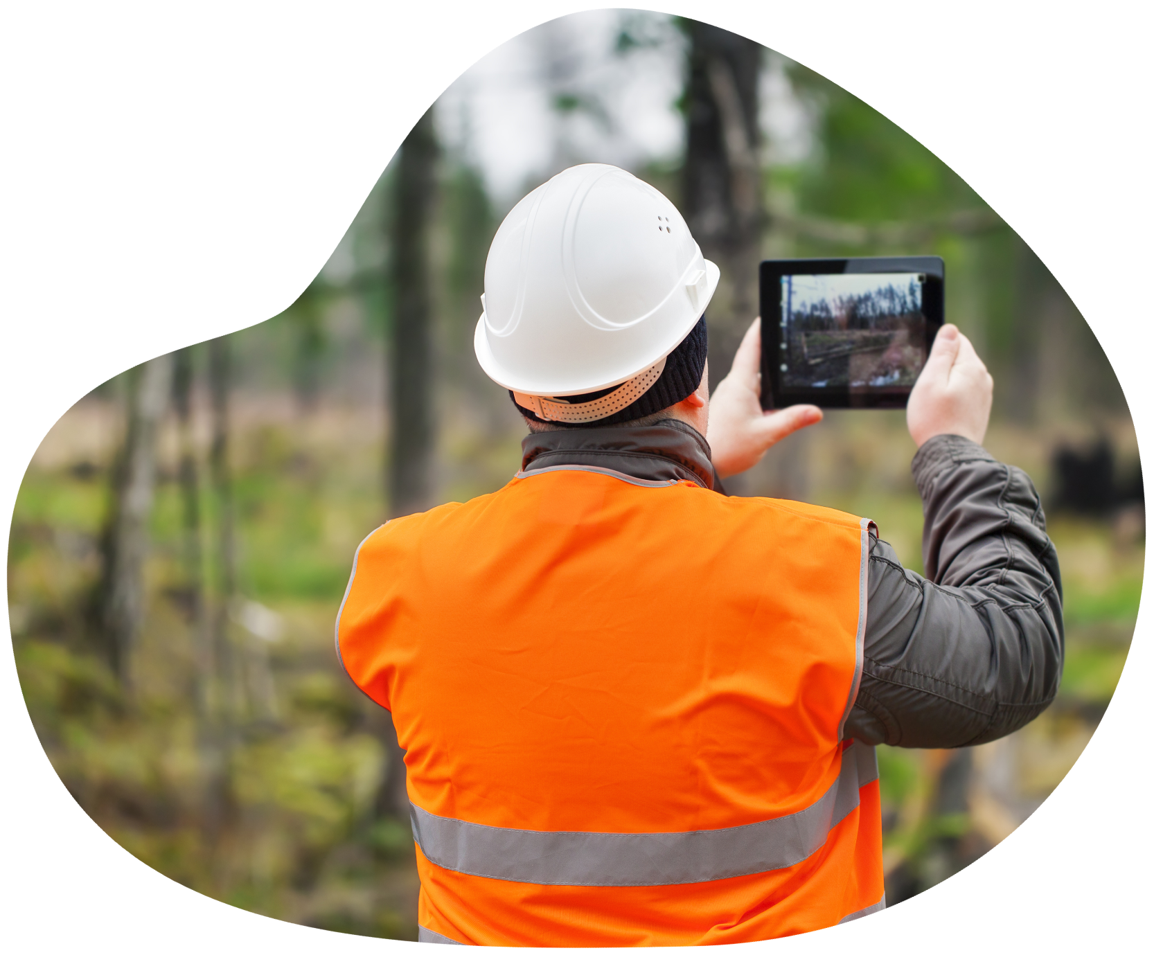 Person in hardhat and vest measuring collecting environmental data