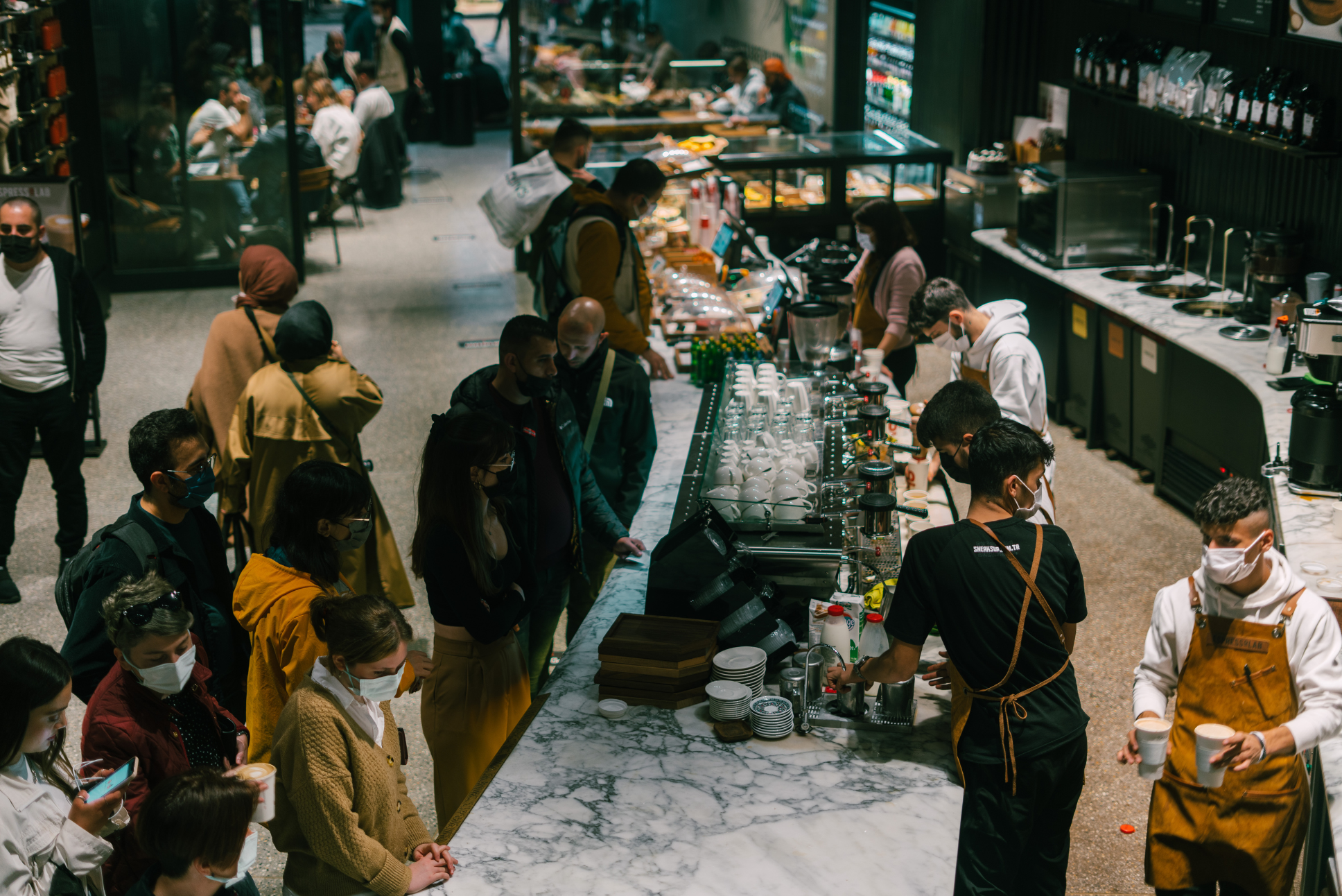 crowd of people in a coffee shop